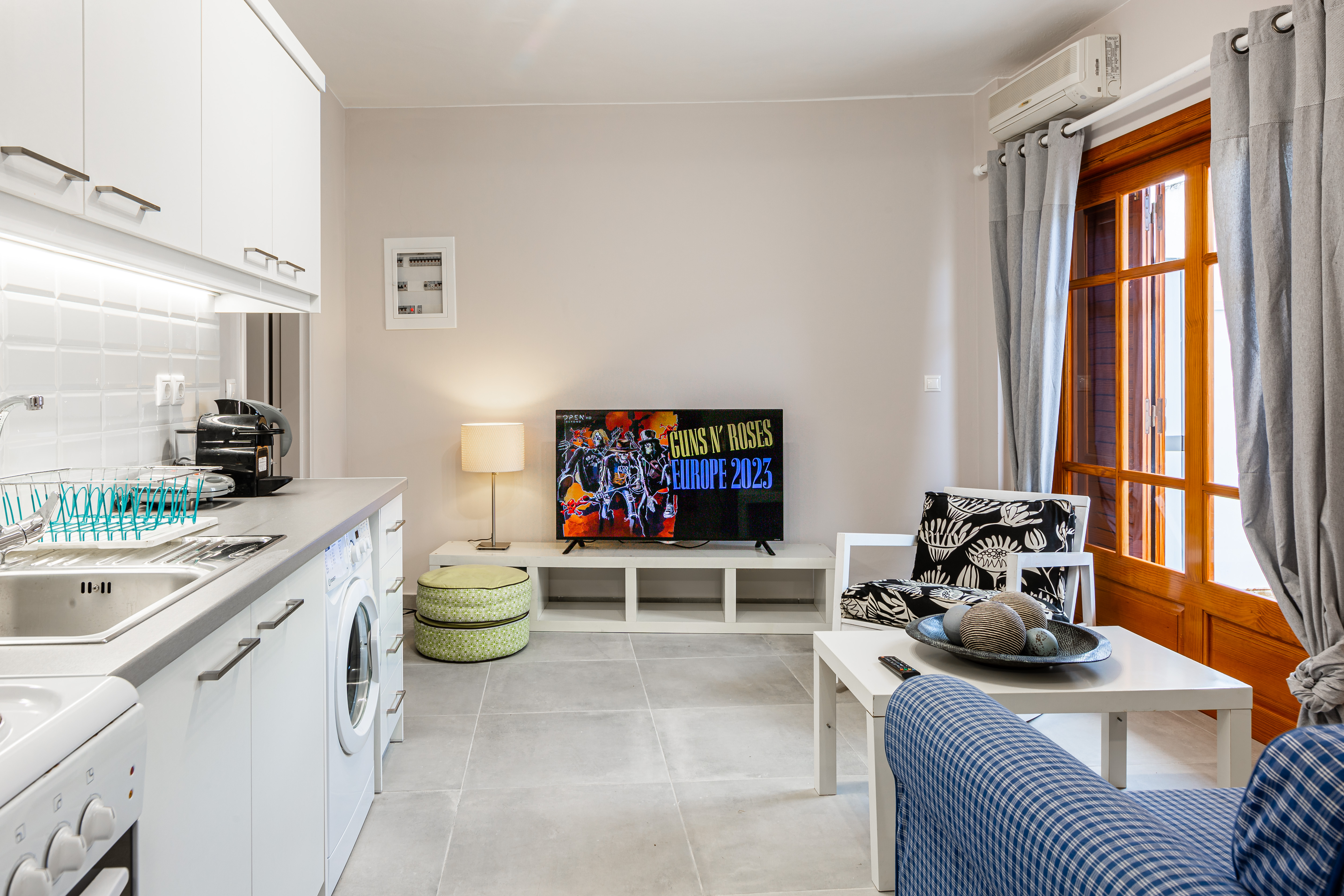 Living room with full kitchen