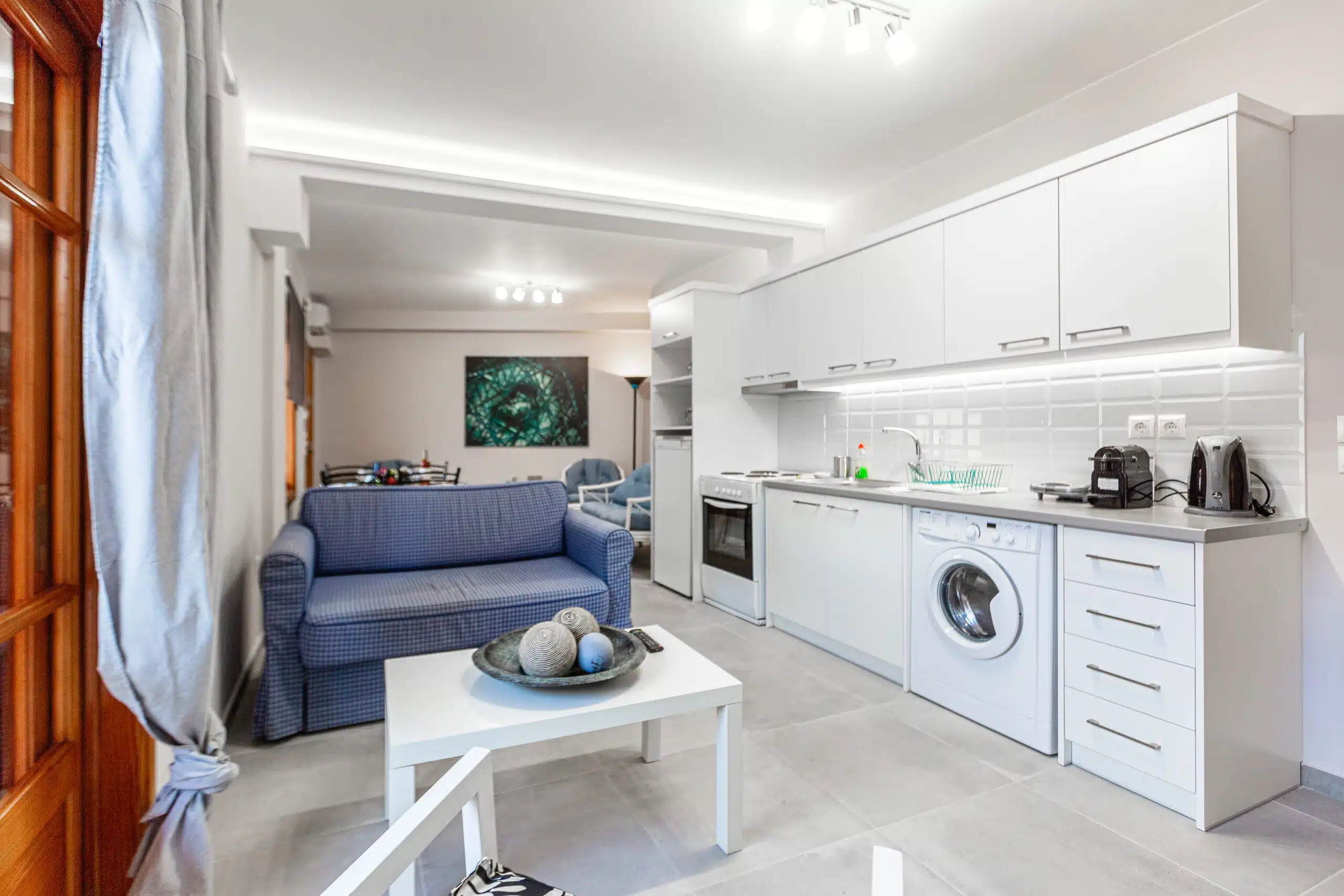 Apartment living room with full kitchen