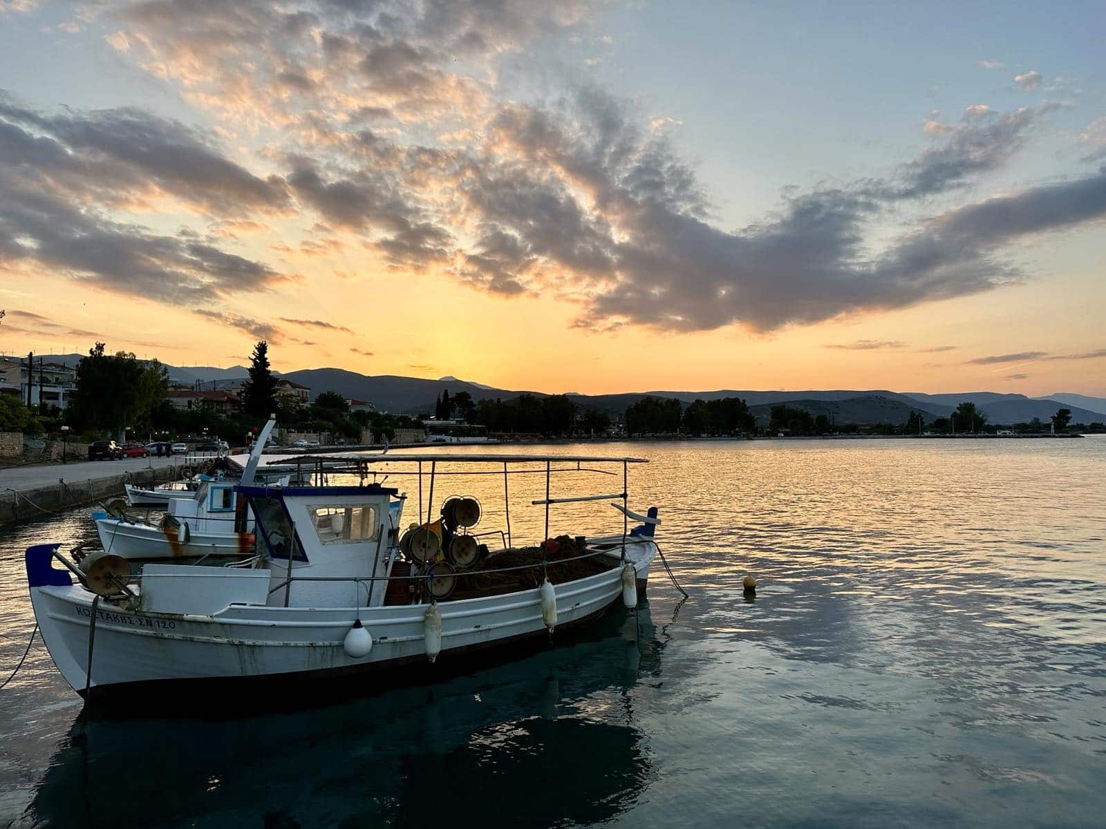 Waterfront of Kiveri in the sunset, appearing a fishing boat