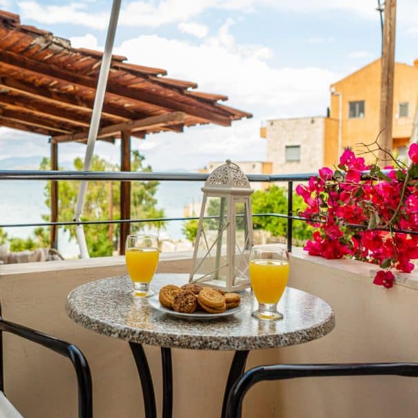 Apartment's balcony view with a small table for 2 persons.