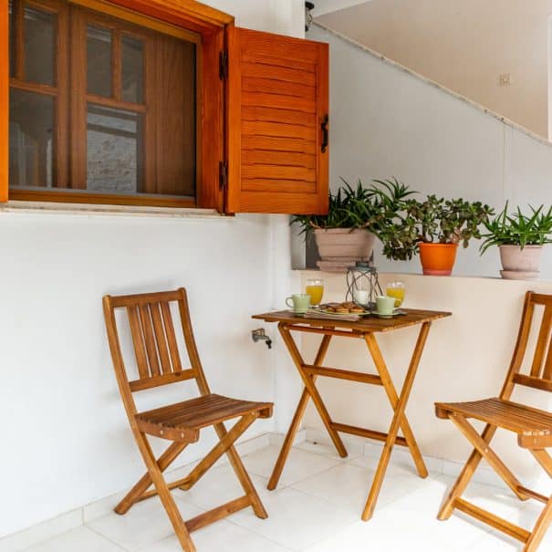 balcony area of Aroma's studio with a table for 2 persons