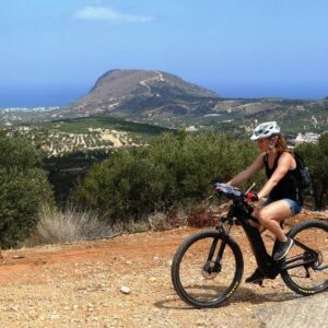 a woman with a bike tour