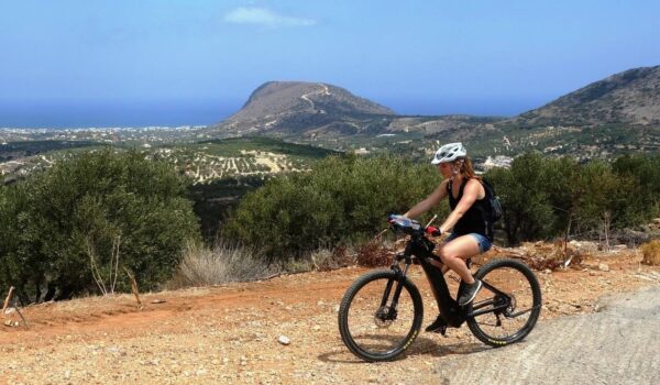 a woman with a bike tour